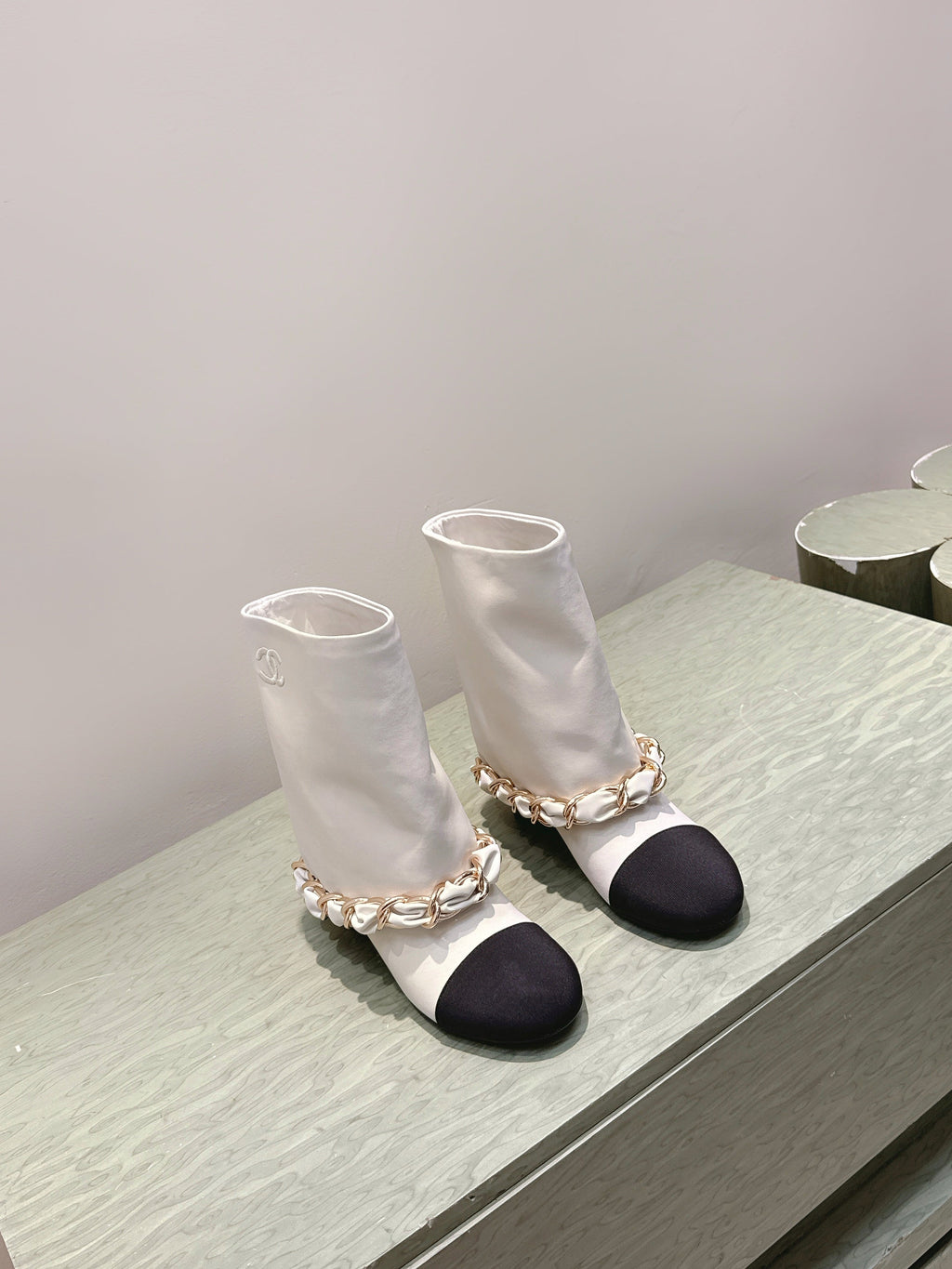 CHANEL 25S CALF-LENGTH BOOTS 45MM IN WHITE AND BLACK CALFSKIN GOLD HARDWARE
