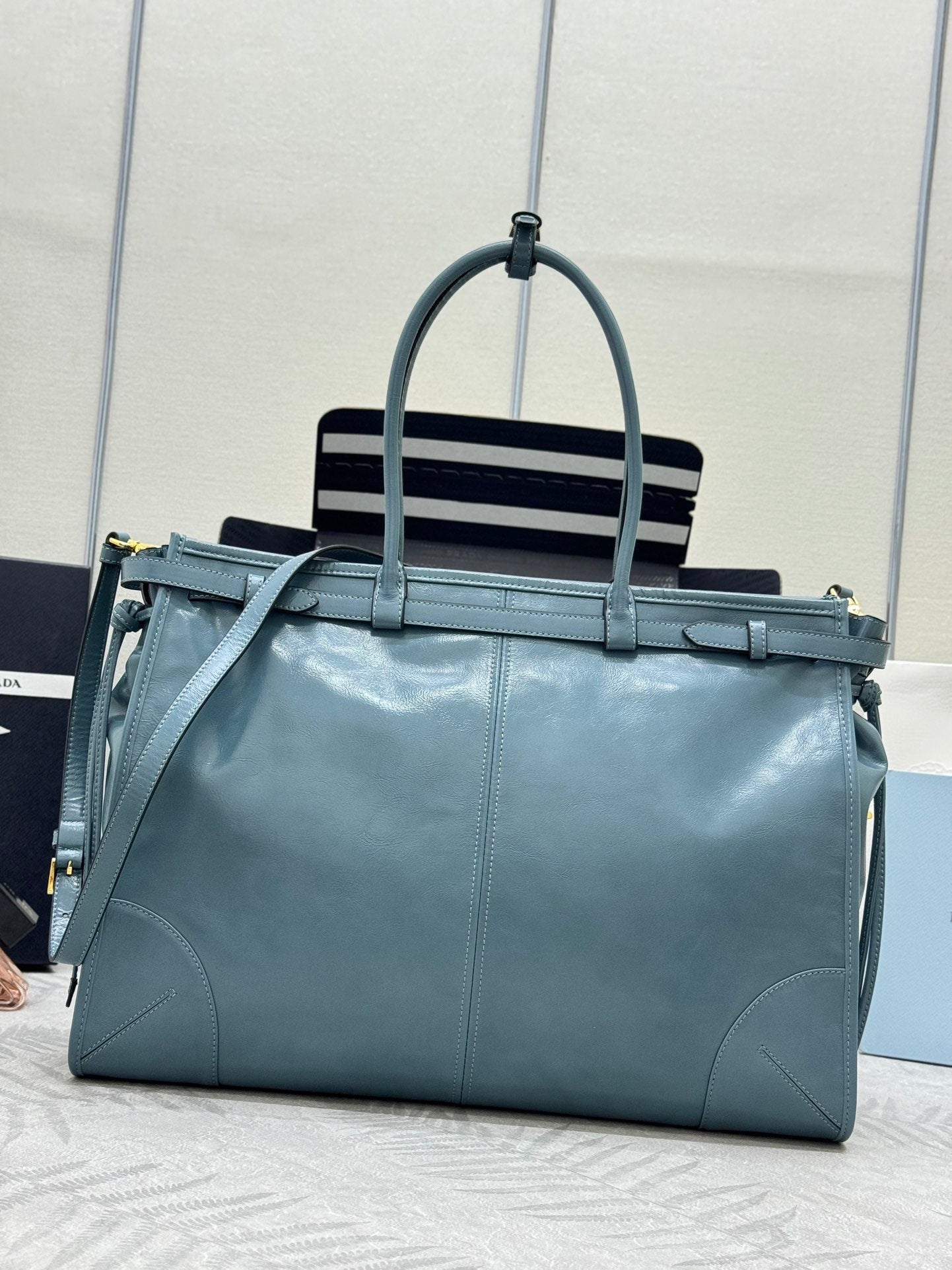 PRADA 25S LUX SOFT BAG 42 IN BLUE GLOSSY CALFSKIN GOLD HARDWRE